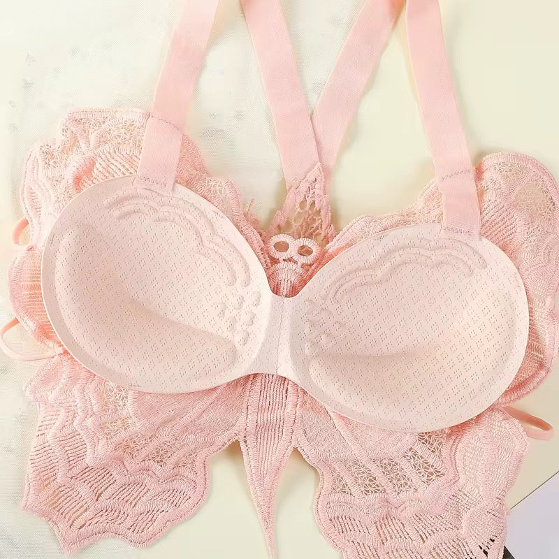 Pink lace bra on a light background