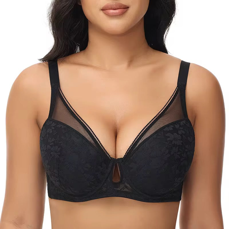 Black lace bra worn by a model on a white background