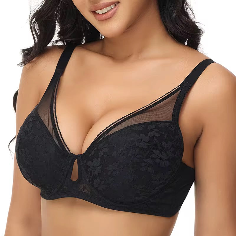 Black lace bra worn by a model on a white background
