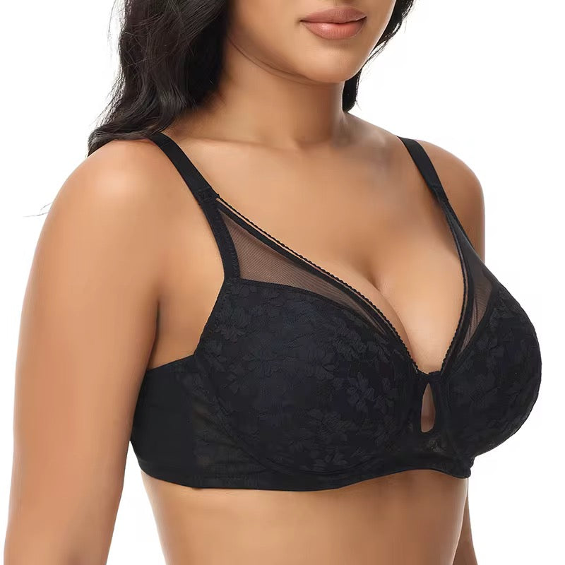 Black lace bra on a model against a white background
