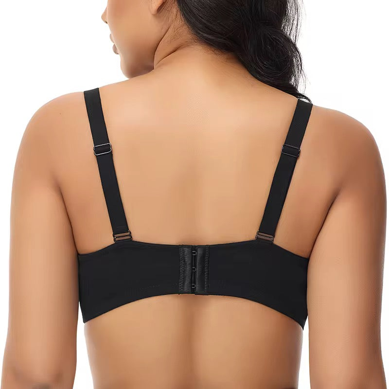 Black bra worn by a model on a white background