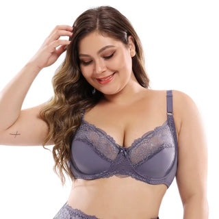 Woman wearing a blue lace bra on a white background