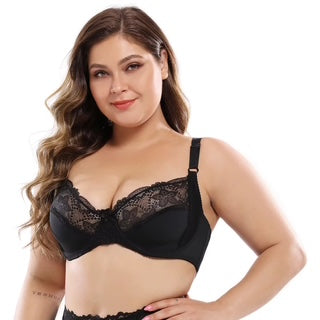 Woman wearing a black lace bra on a white background