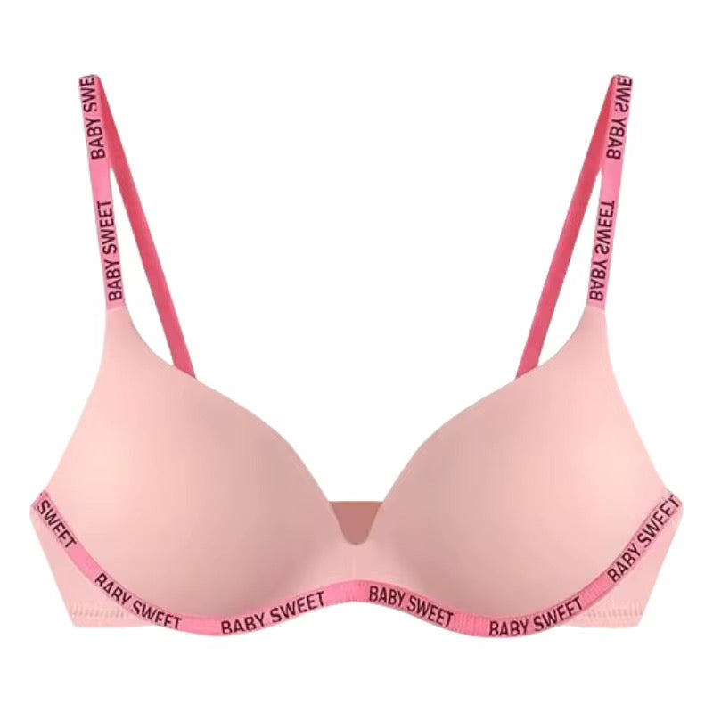 Pink bra with 'BABY SWEET' lettering on straps and band against a white background