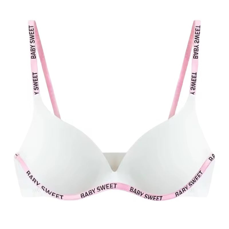 White bra with pink straps and 'BABY SWEET' lettering on a white background