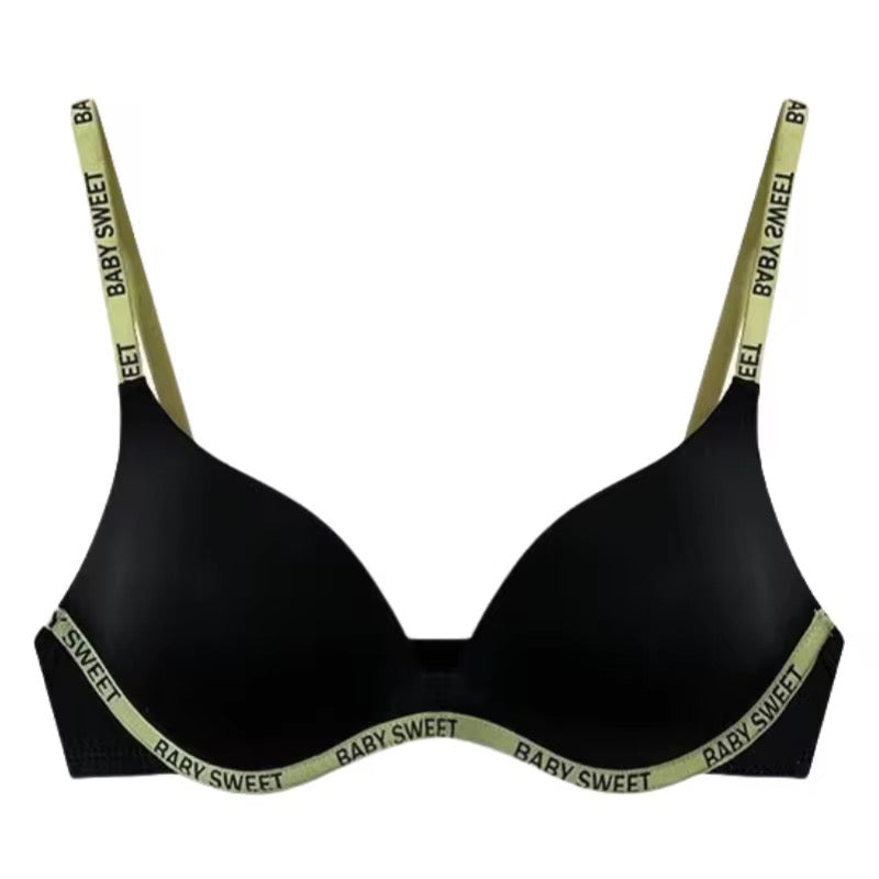 Black bra with 'Baby Sweet' green straps on a white background