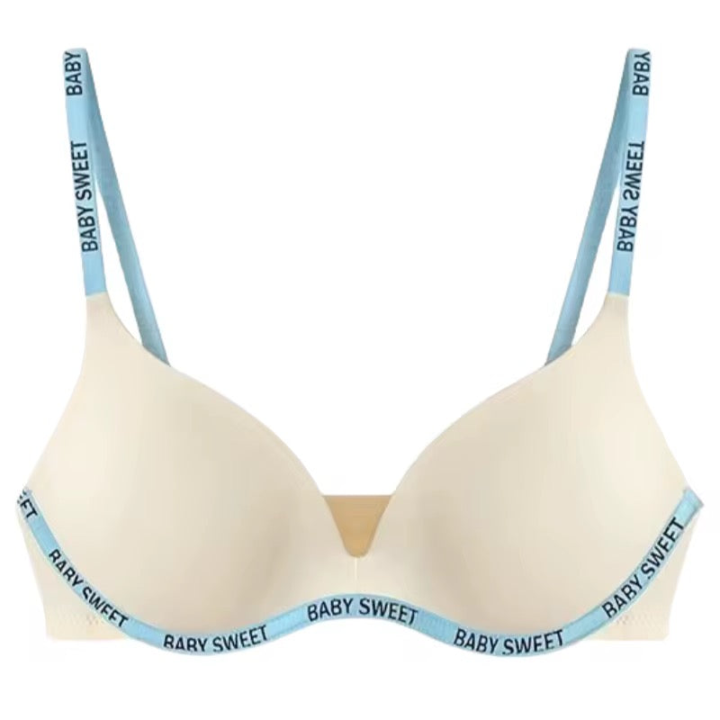 Beige bra with blue straps and 'Baby Sweet' text on a white background