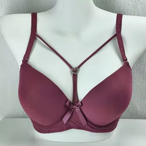 Mauve bra on a mannequin against a white background