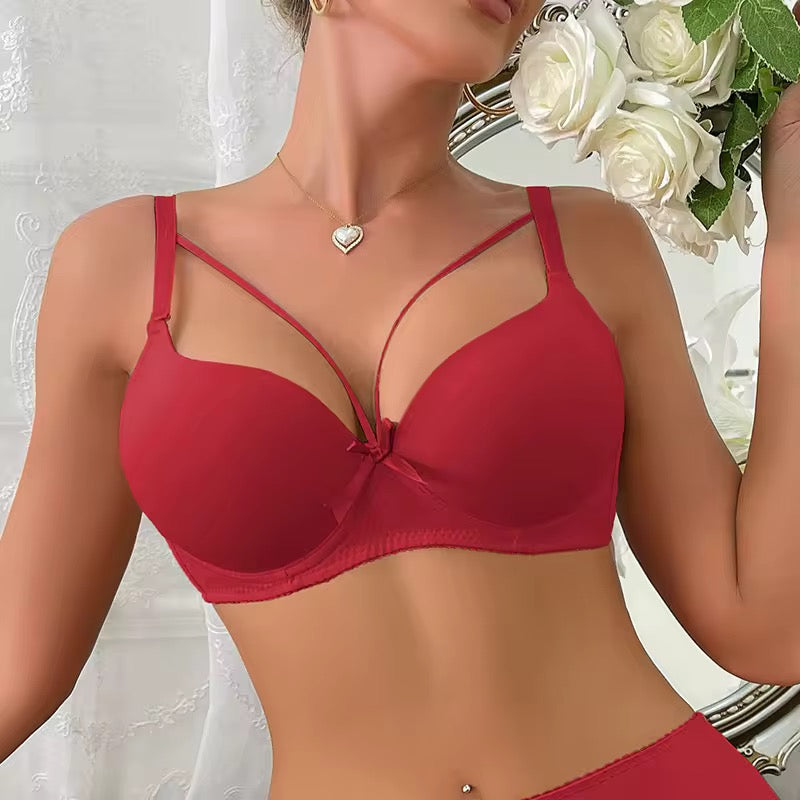 Red bra worn by a model with white roses in the background