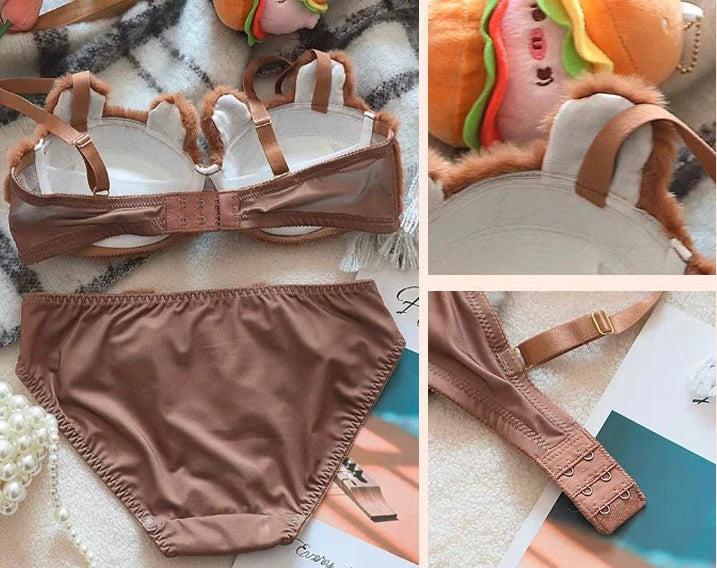 Brown bikini set with matching top and bottom on a textured surface.