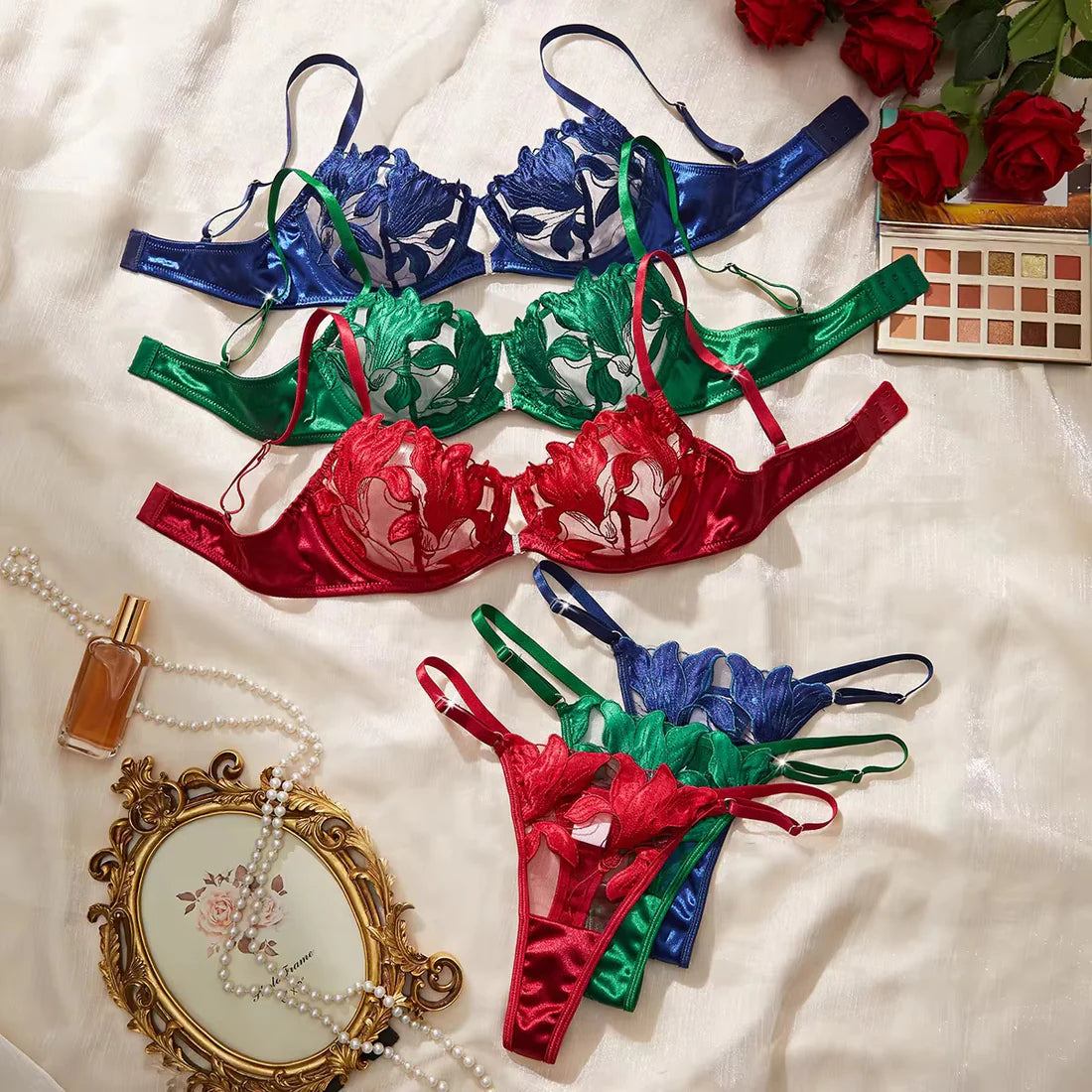 Colorful lingerie set on a white surface with decorative items.