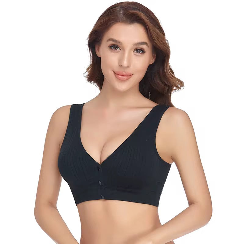 Woman wearing a black bralette on a white background