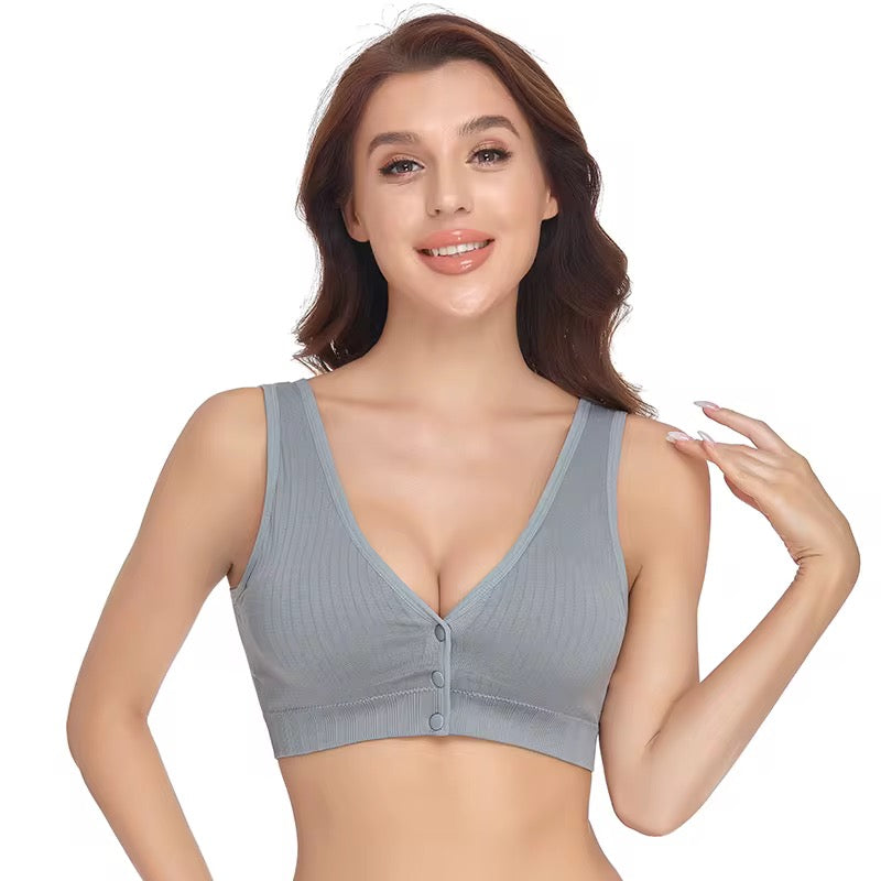 Woman wearing a gray ribbed bralette on a white background