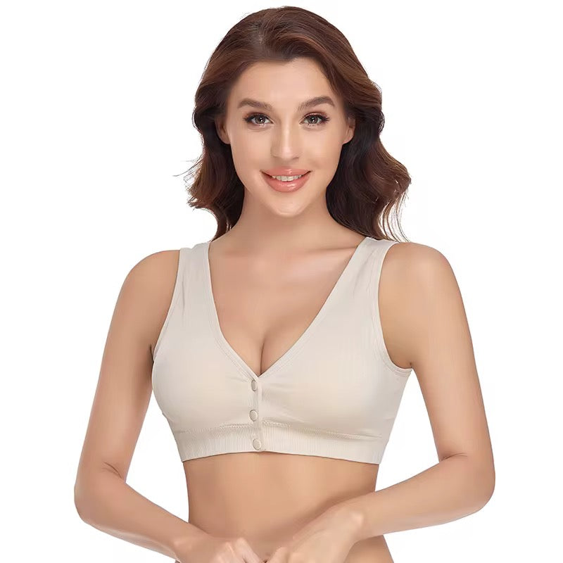 Woman wearing a beige bralette on a white background