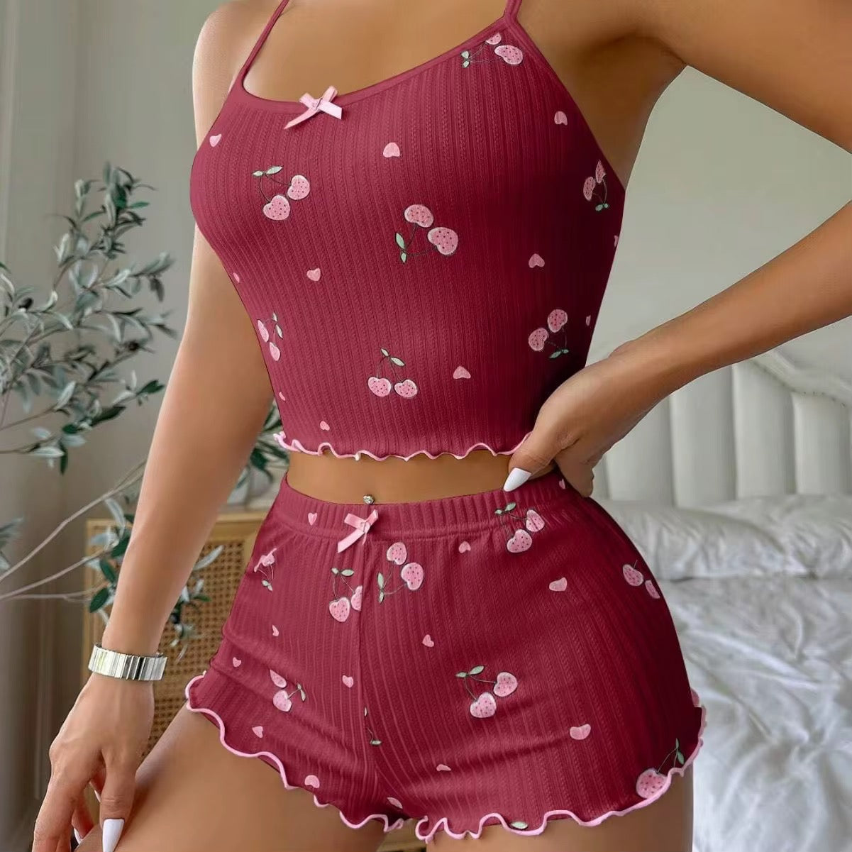 Red ribbed crop top and shorts set with pink heart patterns on a neutral background