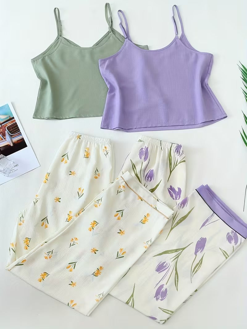 Three camisole tank tops in sage green, lavender, and cream with floral prints, arranged on a white background with matching patterned pants.