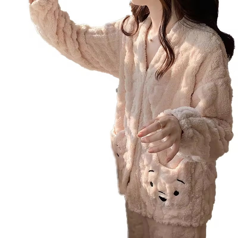 Person wearing a beige plush outfit with animal face designs on a white background