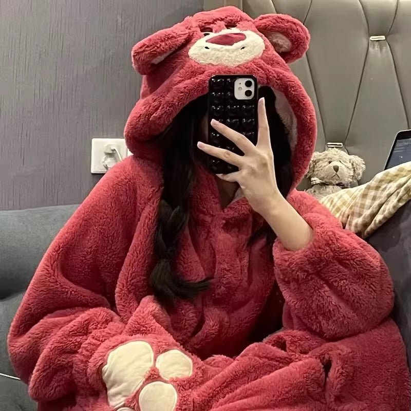 Person wearing a red bear-themed hoodie taking a selfie.