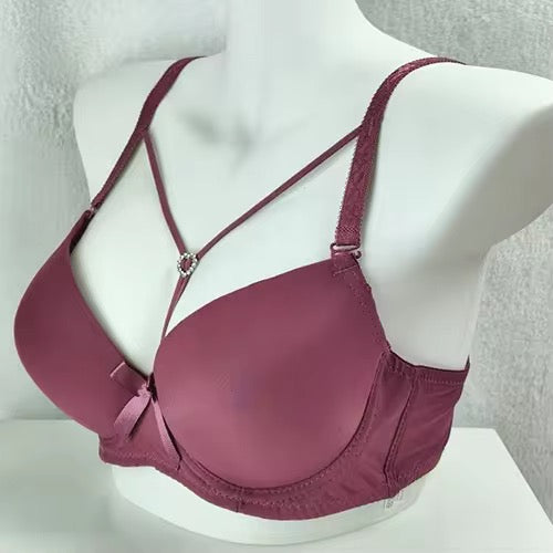 Mauve bra on a mannequin against a neutral background