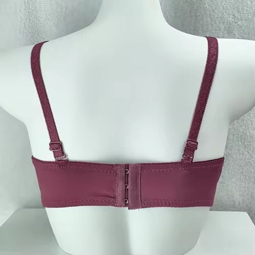 Purple bra on a mannequin with a gray background
