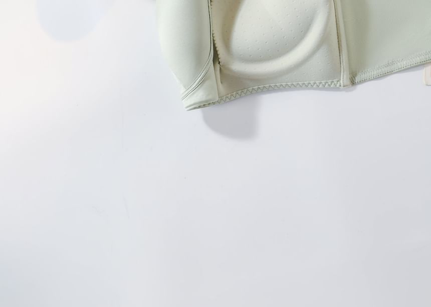 White bra on a light gray background