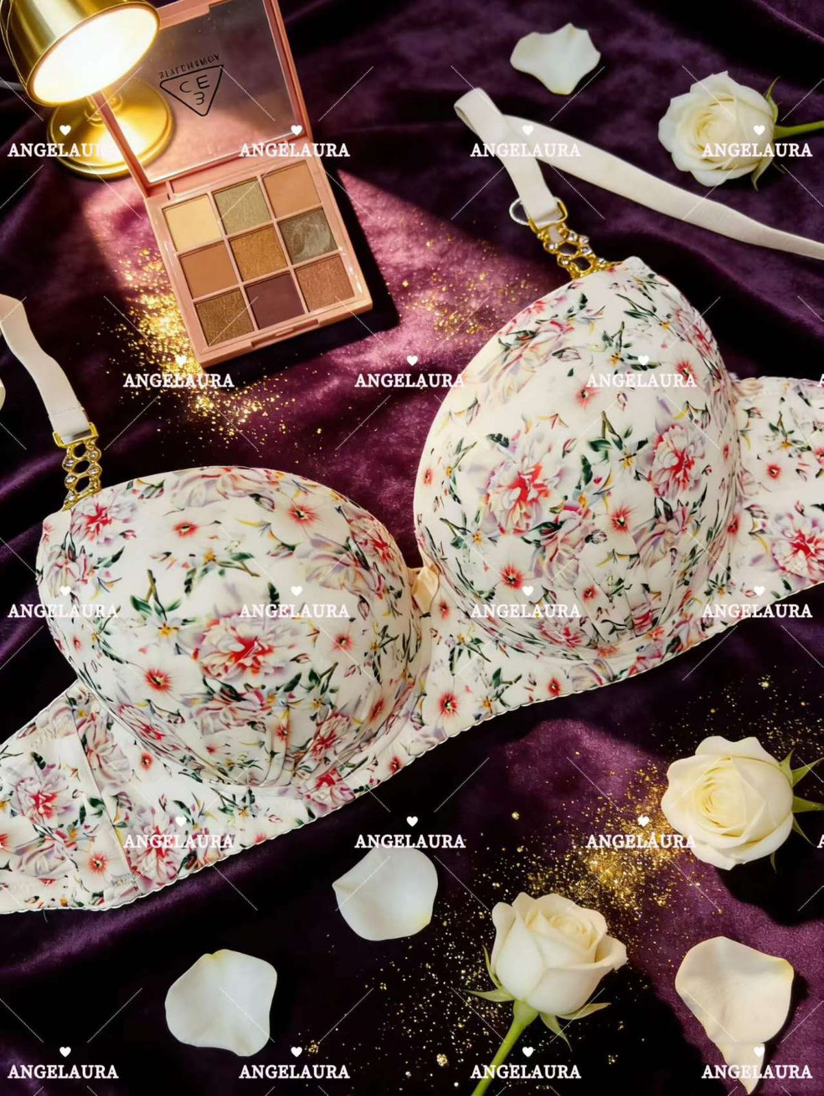 Floral-patterned bra on a purple fabric background with white roses and makeup products.